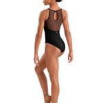 Dancer wearing a black leotard with mesh panels on a white background