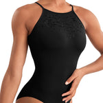 Black leotard worn by a model with a blurred background
