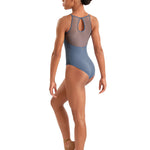 Dancer wearing a blue leotard on a white background