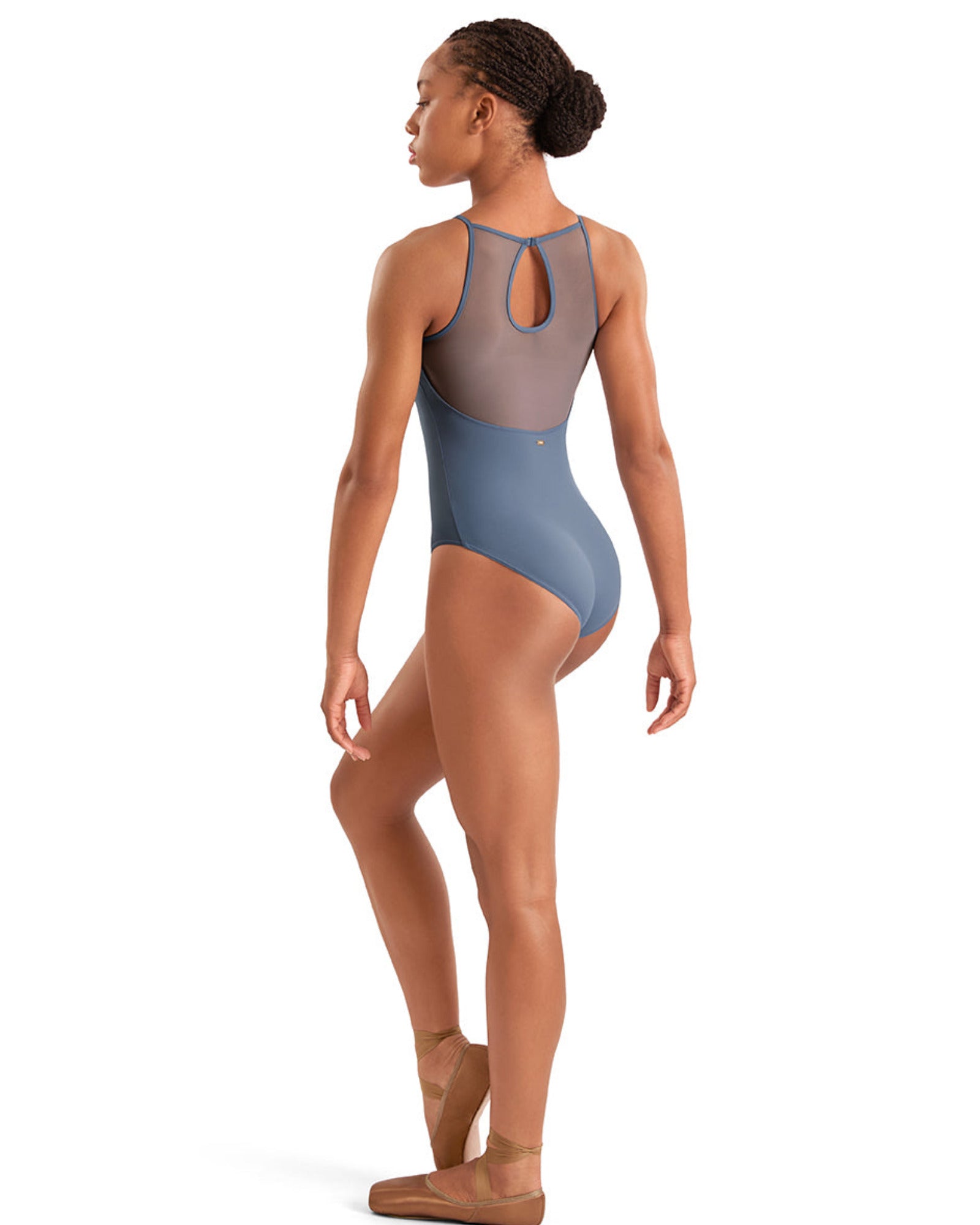 Dancer wearing a blue leotard on a white background