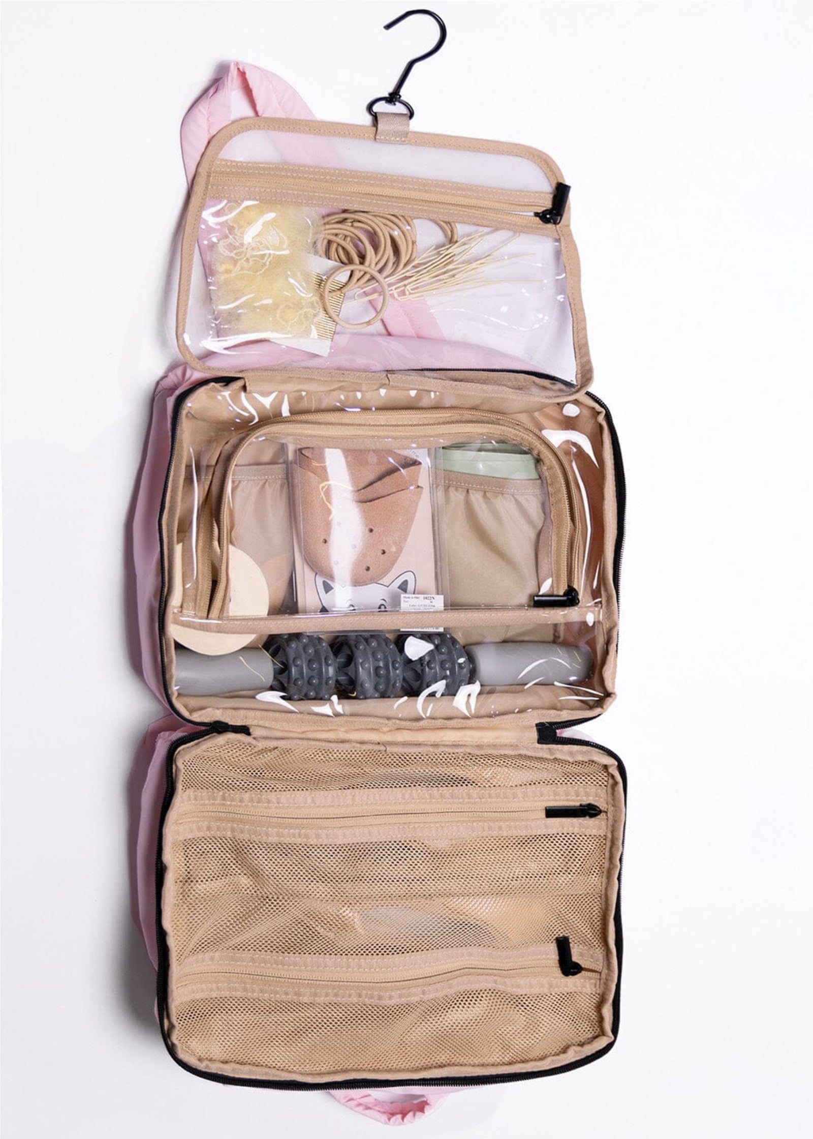 Open beige hanging travel organizer with toiletries on a white background