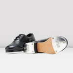 Black tap dance shoe with a metallic tap on a white background