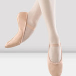 Ballet shoes and tights on a white background