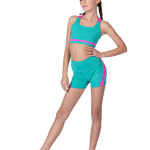 Girl wearing a teal and pink dance outfit on a white background