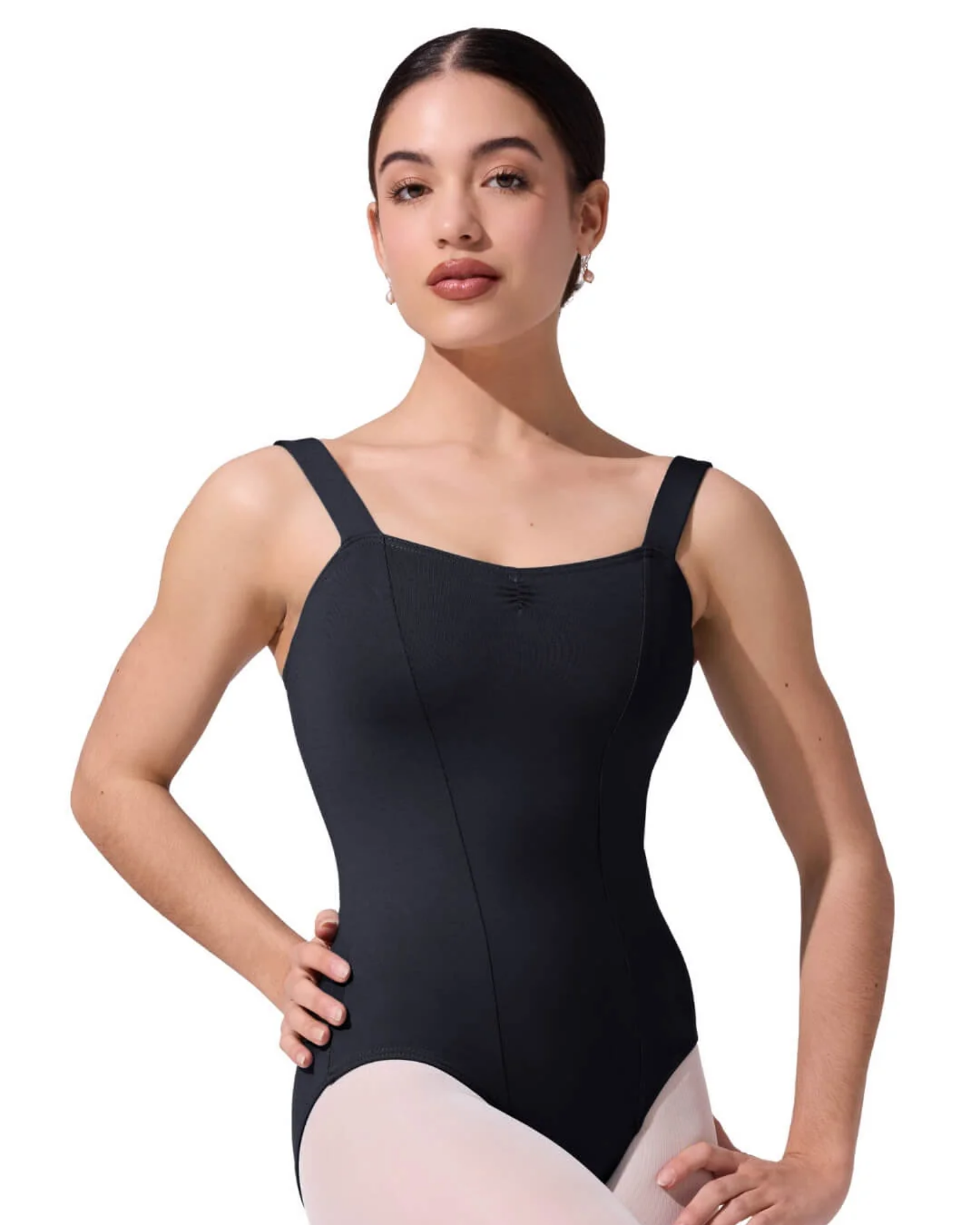 Woman wearing a black leotard on a white background