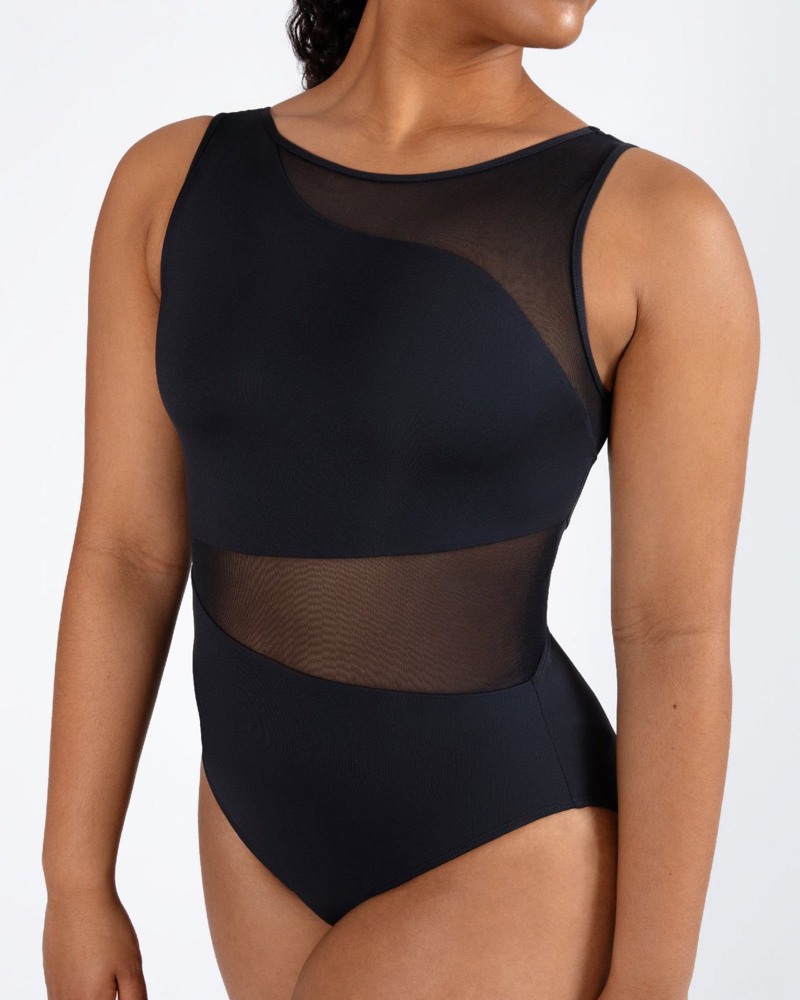 Black sheer leotard worn by a model on a white background