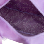 Close-up of a purple dance bag with 'Capezio' branding on a white background