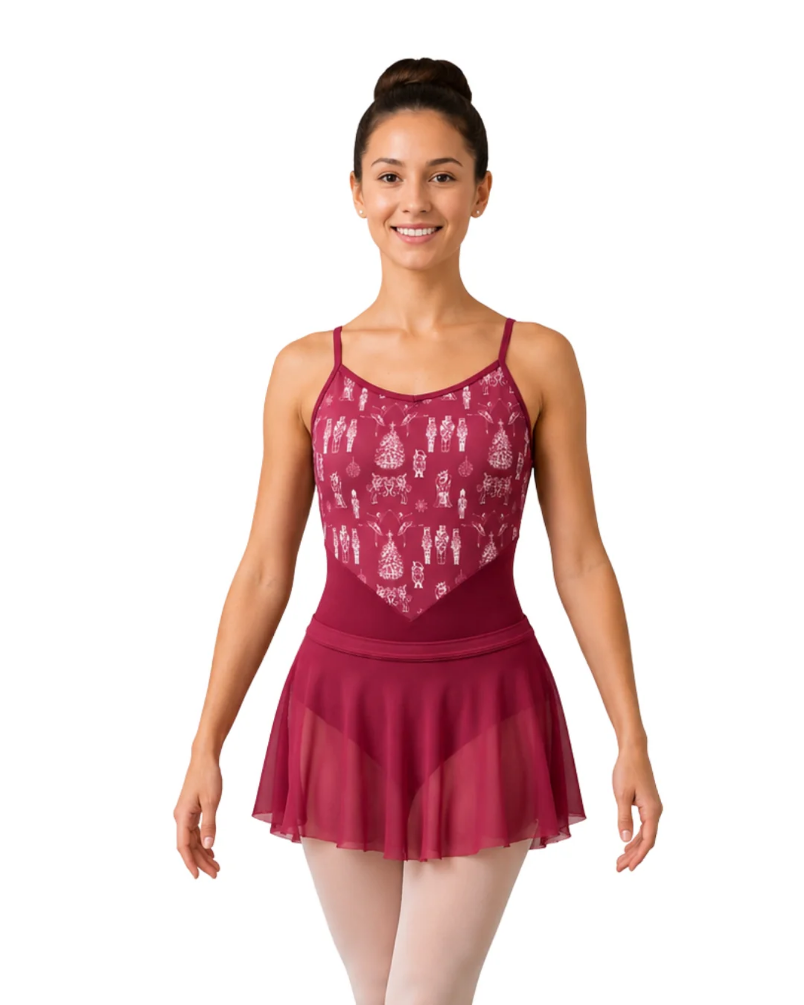 A woman modeling a burgundy dance leotard with a white printed Nutcracker pattern on the bodice and a sheer tulle skirt, set against a plain white background.