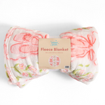 A folded fleece blanket with a pink and green floral pattern on a white background, wrapped in a paper label that reads 'pippi post Fleece Blanket'.