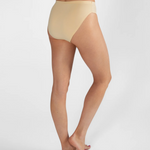 Rear three-quarter view of a model wearing high-waisted, seamless nude beige underwear against a light gray studio background.