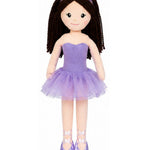 Doll in a purple dress with a headband on a white background