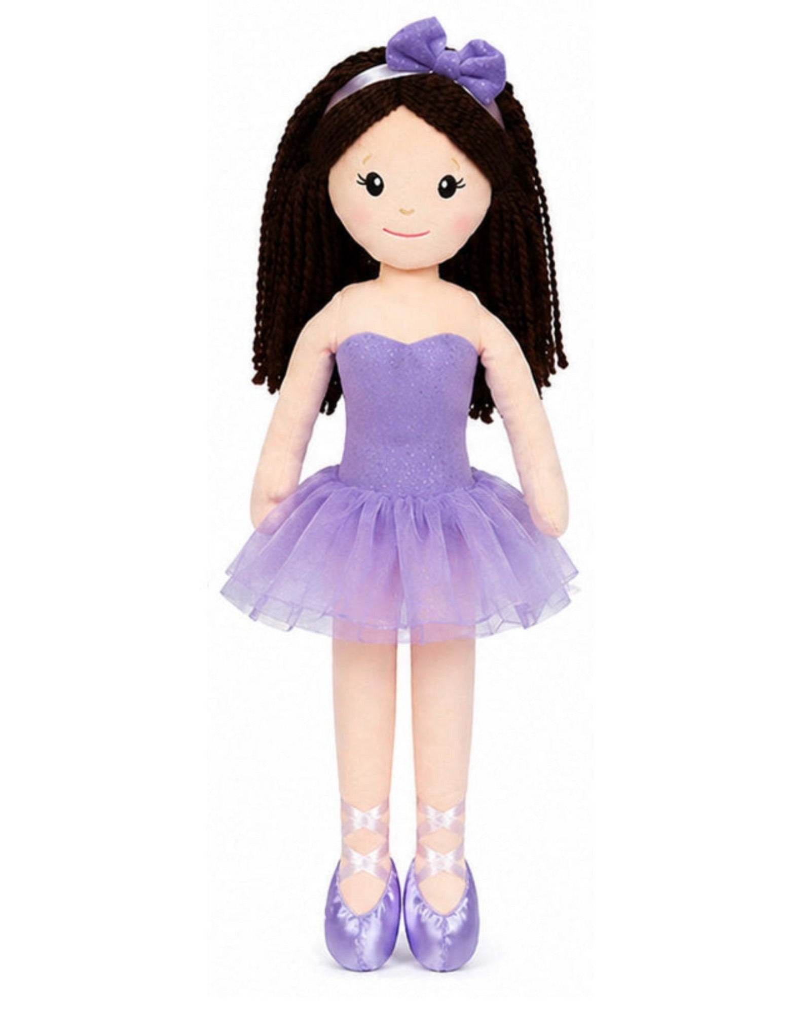 Doll in a purple dress with a headband on a white background