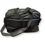 A black nylon duffel bag with dual top handles and an adjustable shoulder strap, shown on a plain white background.