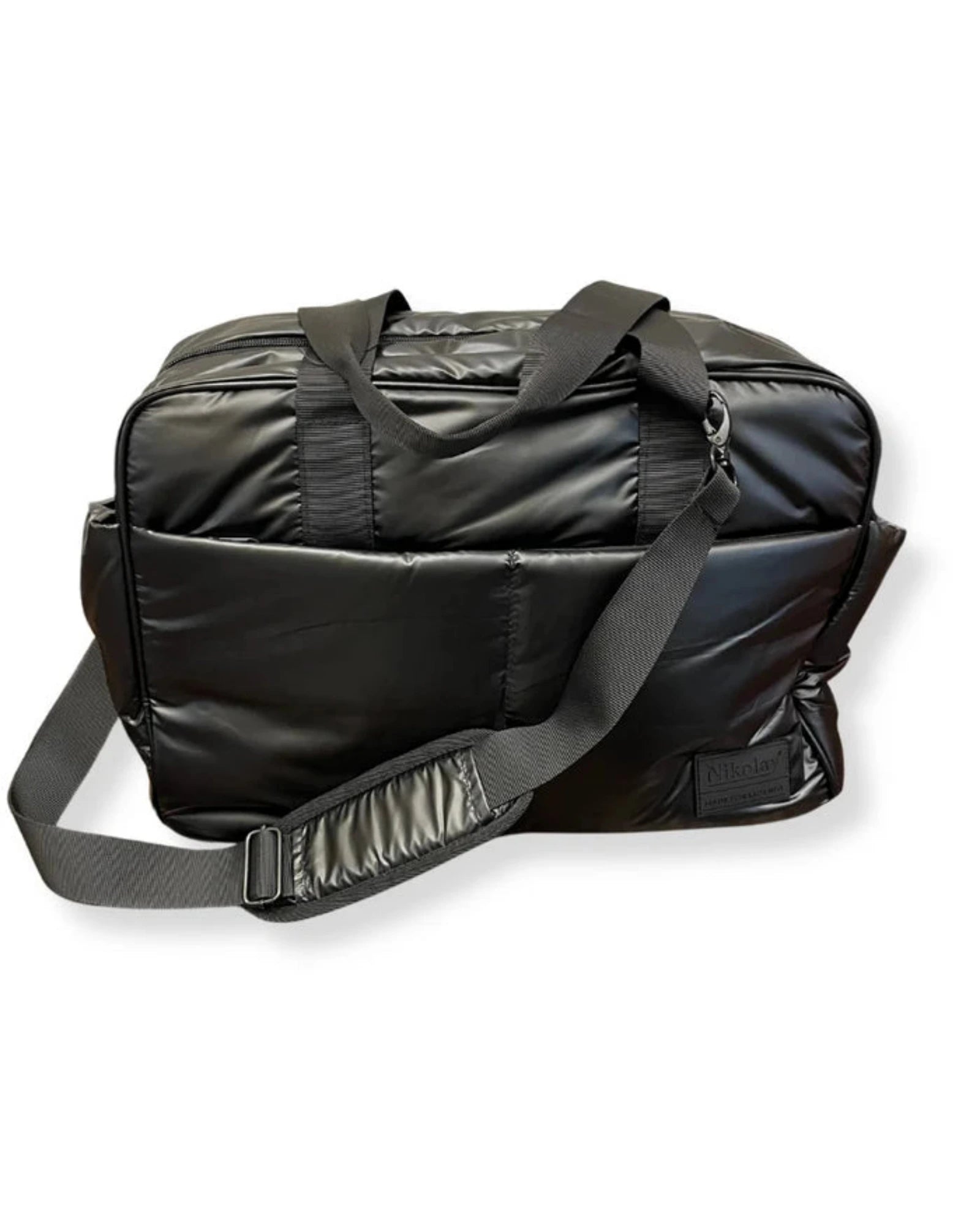 A black nylon duffel bag with dual top handles and an adjustable shoulder strap, shown on a plain white background.