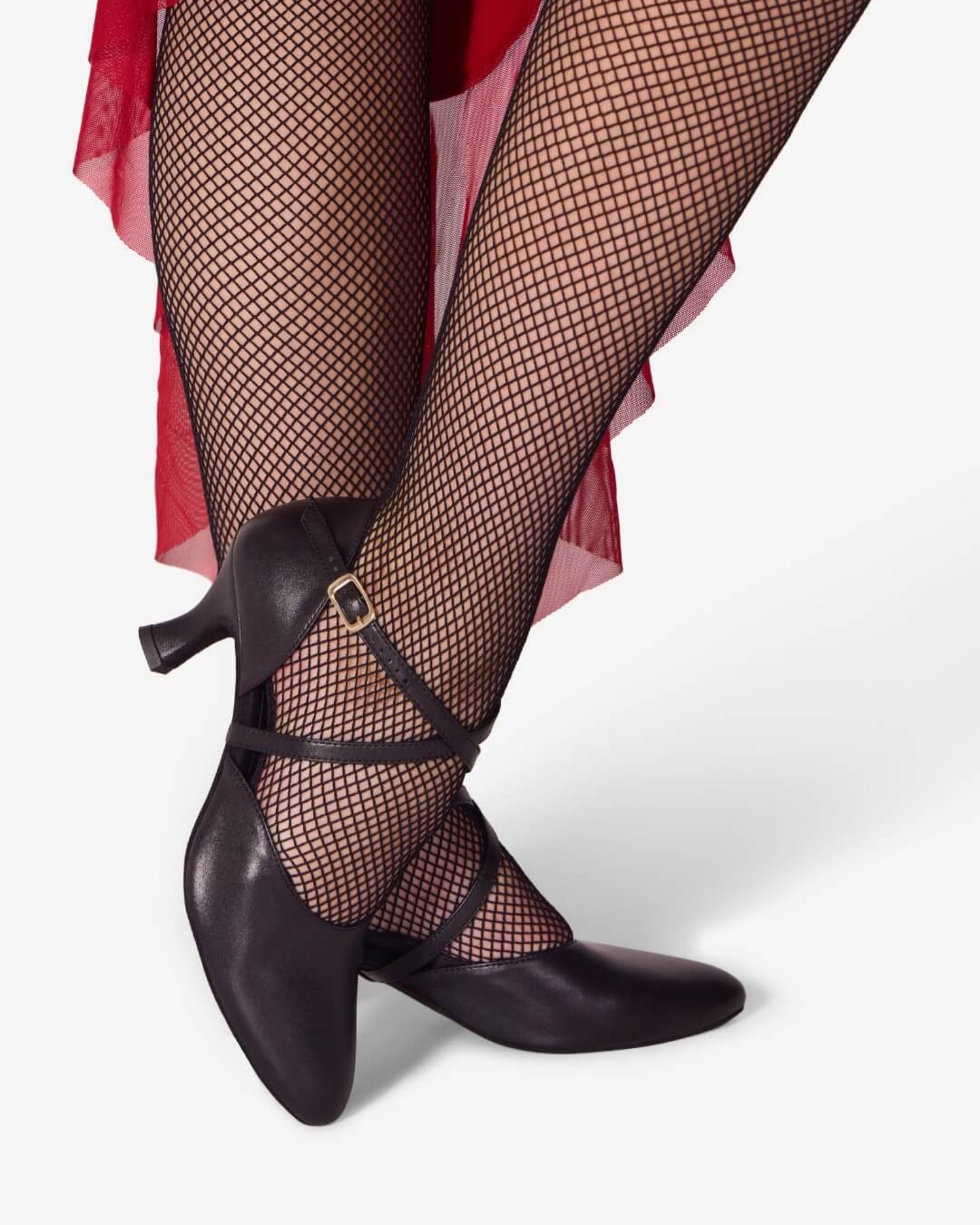 Black high-heeled shoes with fishnet stockings on a white background