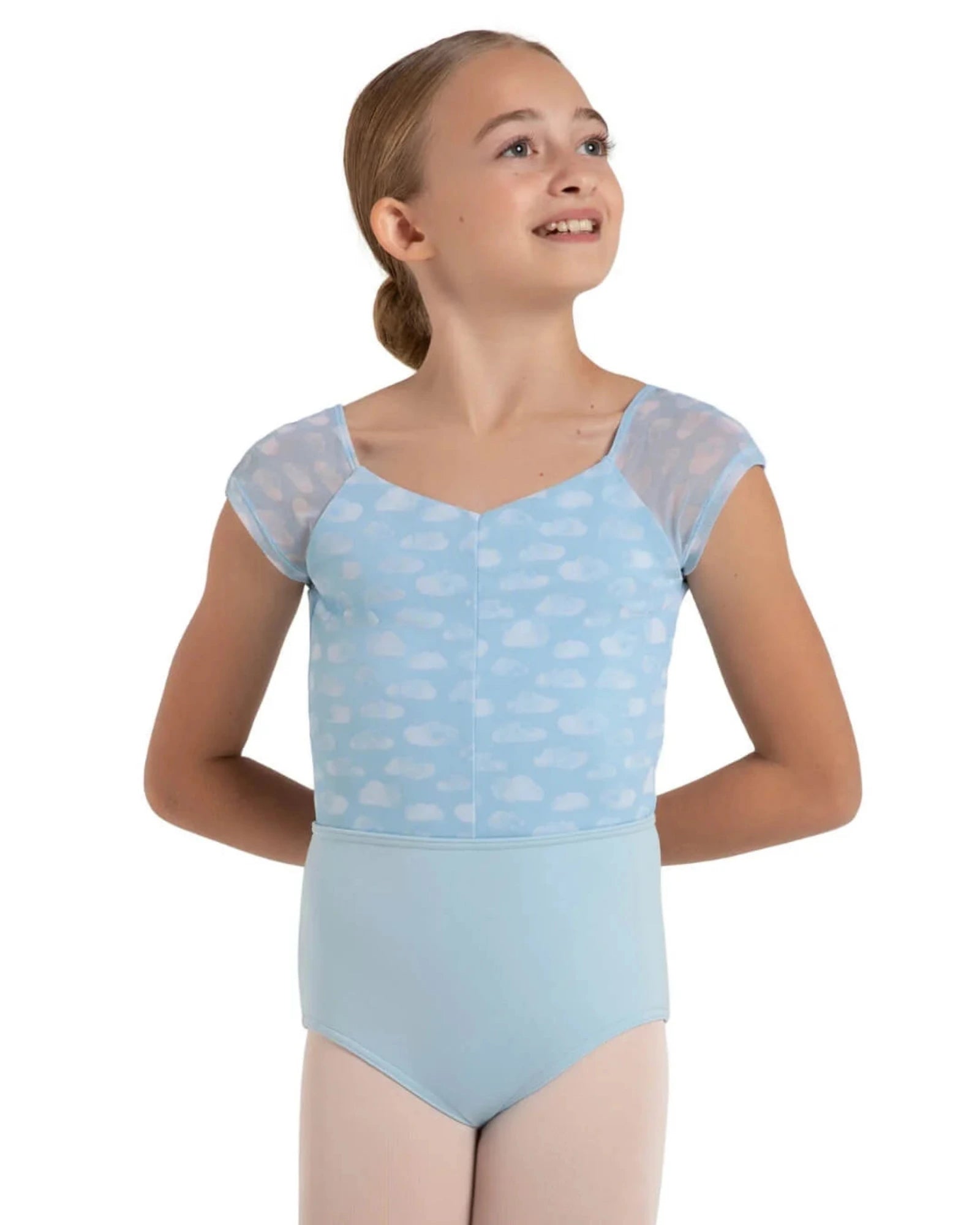 A young girl modeling a light blue leotard with a cloud pattern on the top half and solid light blue bottoms, set against a plain white background.