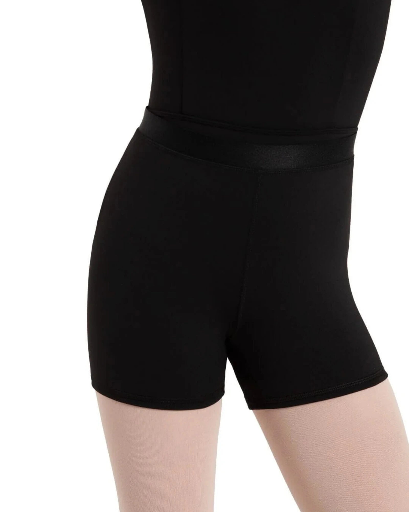 Close-up of a person wearing black high-waisted dance shorts with a ribbon waist band and a matching black leotard, shown against a plain white background.
