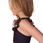 Black halter top with butterfly straps on a white background