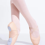 Ballet shoes with pink tights on a white background