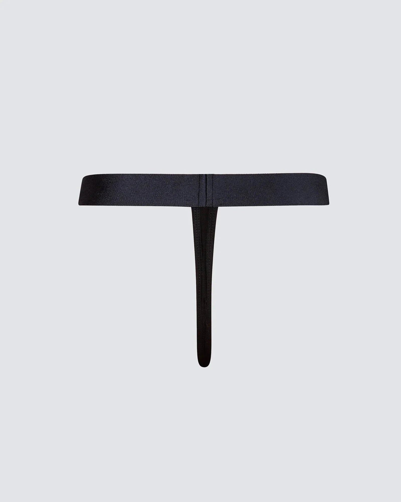 A minimalist black T-shaped belt or waist accessory with a wide horizontal band and a single vertical drop, shown flat against a light gray background.