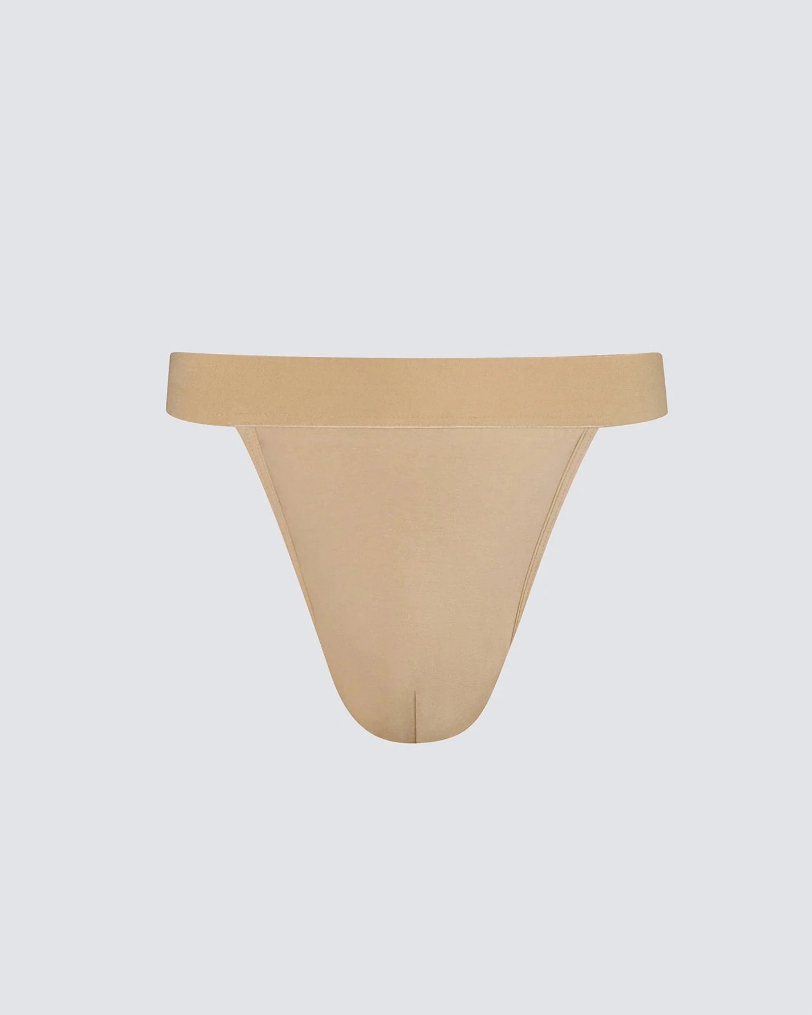Beige thong on a light gray background