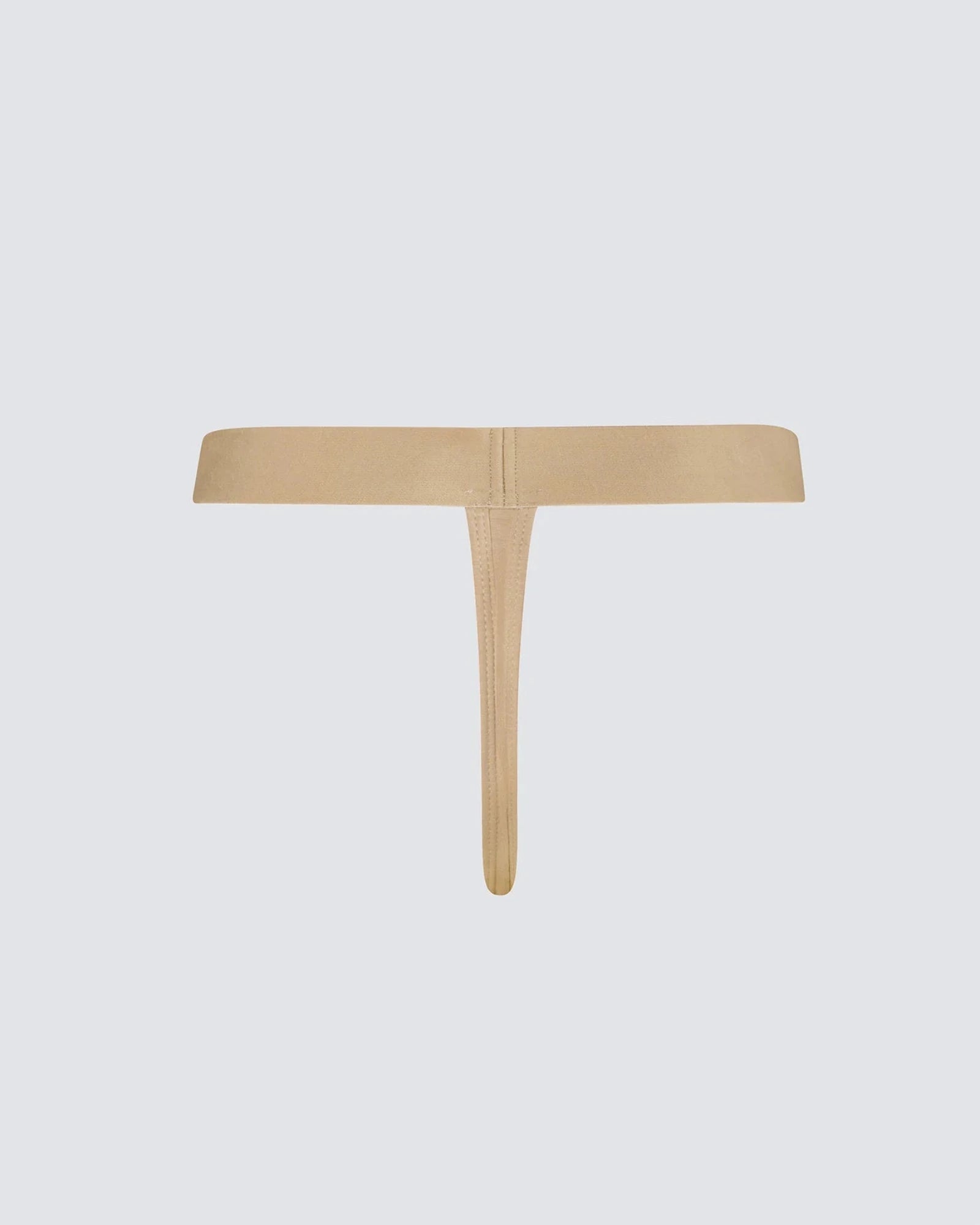 Beige thong on a light gray background