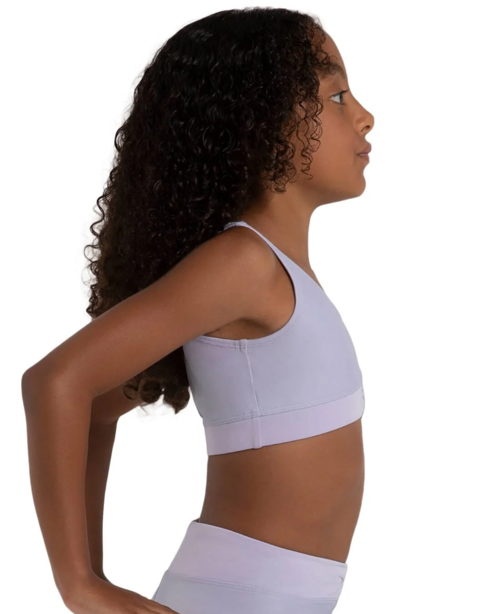 Woman wearing a light purple bra top and leggings on a white background