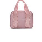 A small pink dance bag with double top handles and decorative vertical stitched details, shown against a plain white background.