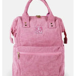 A pink corduroy backpack with dual top handles, a front zippered pocket, and a central embroidered logo patch reading 'GM' with a running figure, shown against a plain light background.
