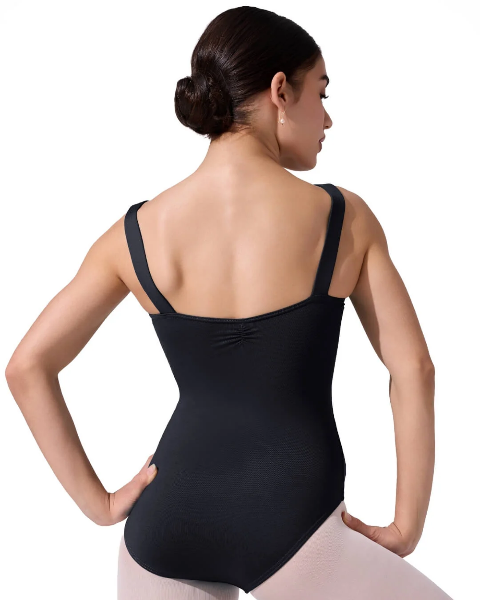 Person wearing a black leotard on a white background
