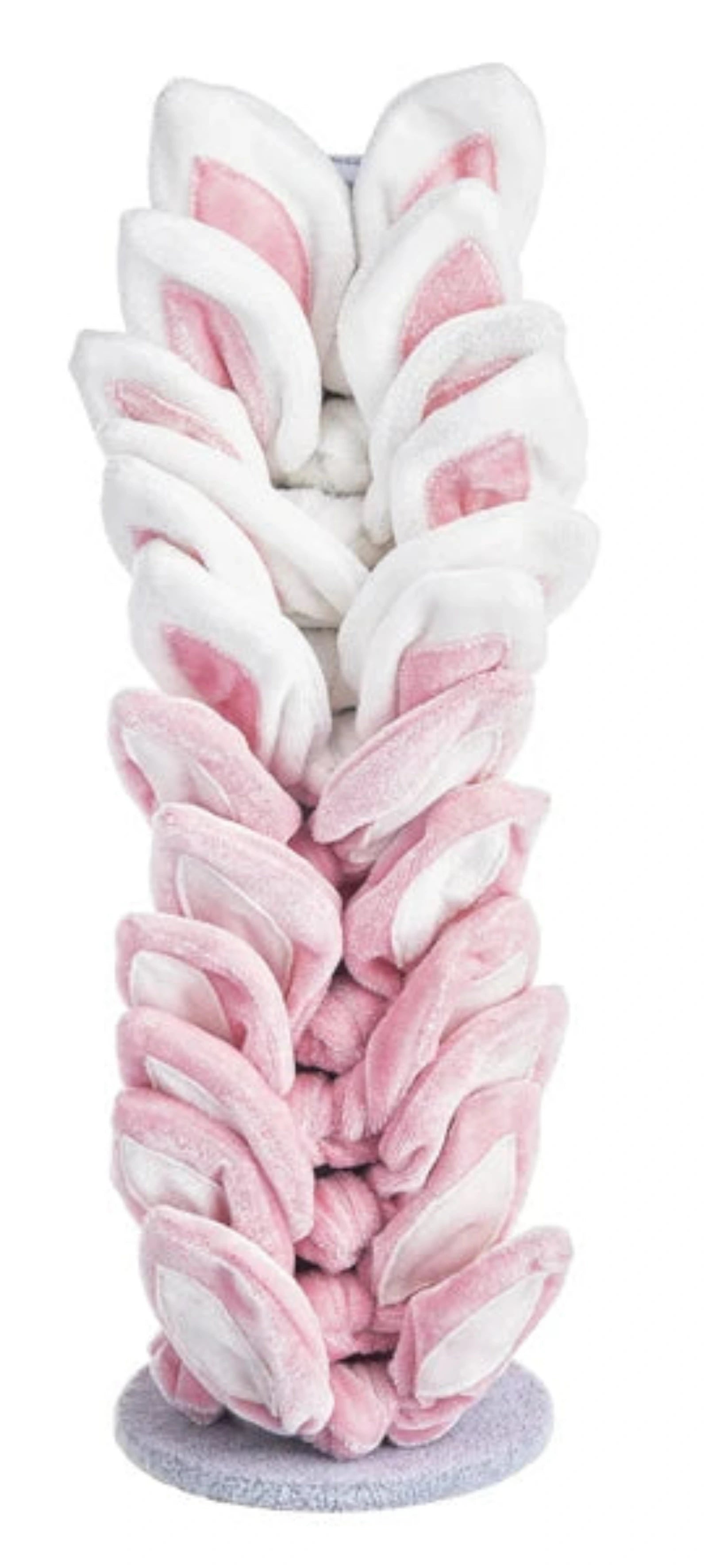 A plush bunny-ear tree stand featuring multiple tiers of soft white and pink bunny ears on a gray circular base, shown against a plain white background.