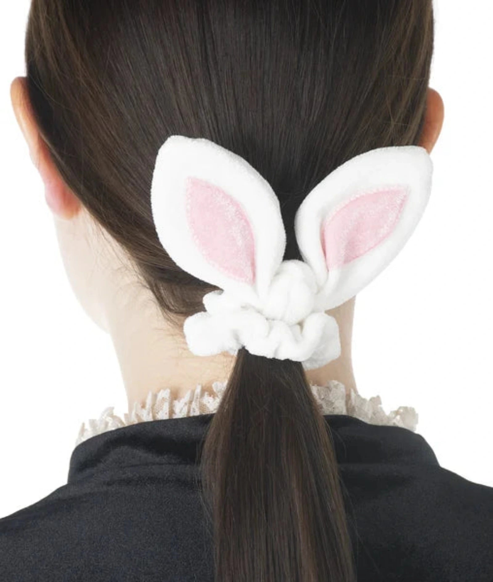 Person wearing bunny ears with a white background