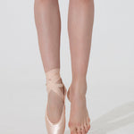 Ballet dancer wearing pink ballet shoes on a white background