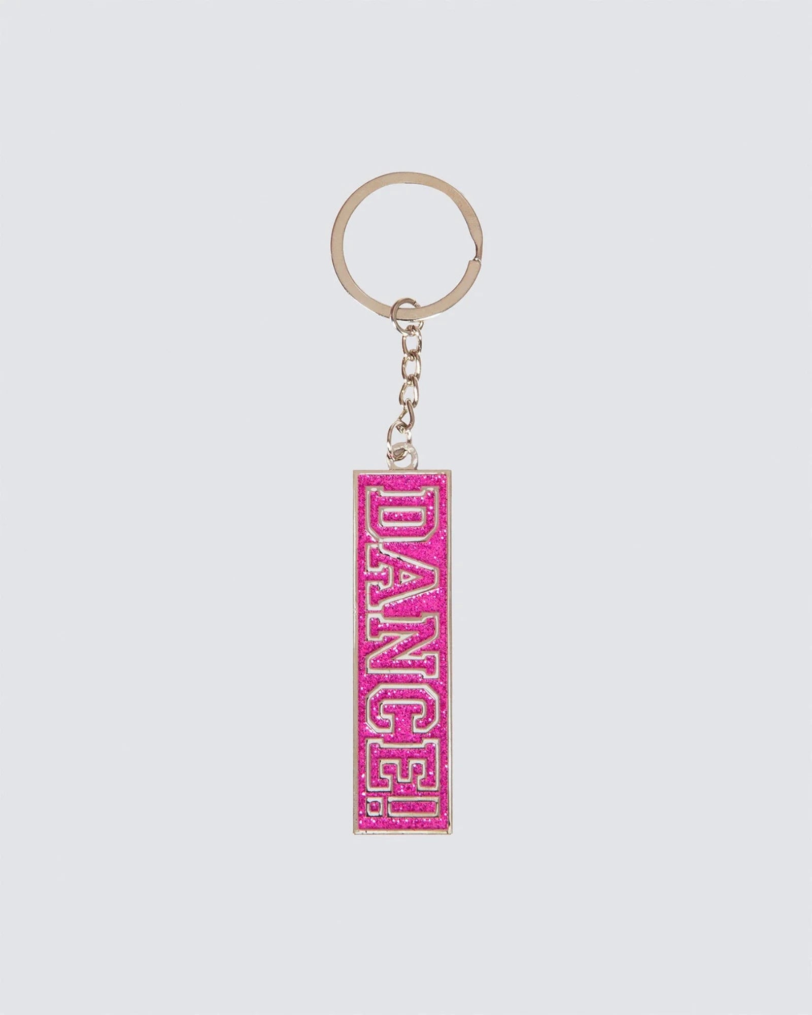 Keychain with 'DANCE!' text on a pink rectangular tag against a light gray background