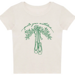 An off-white short-sleeve t-shirt with a green graphic of a bouquet of mistletoe and ballet slippers, with the cursive text 'pointe your mistletoes' above them, displayed on a solid white background.
