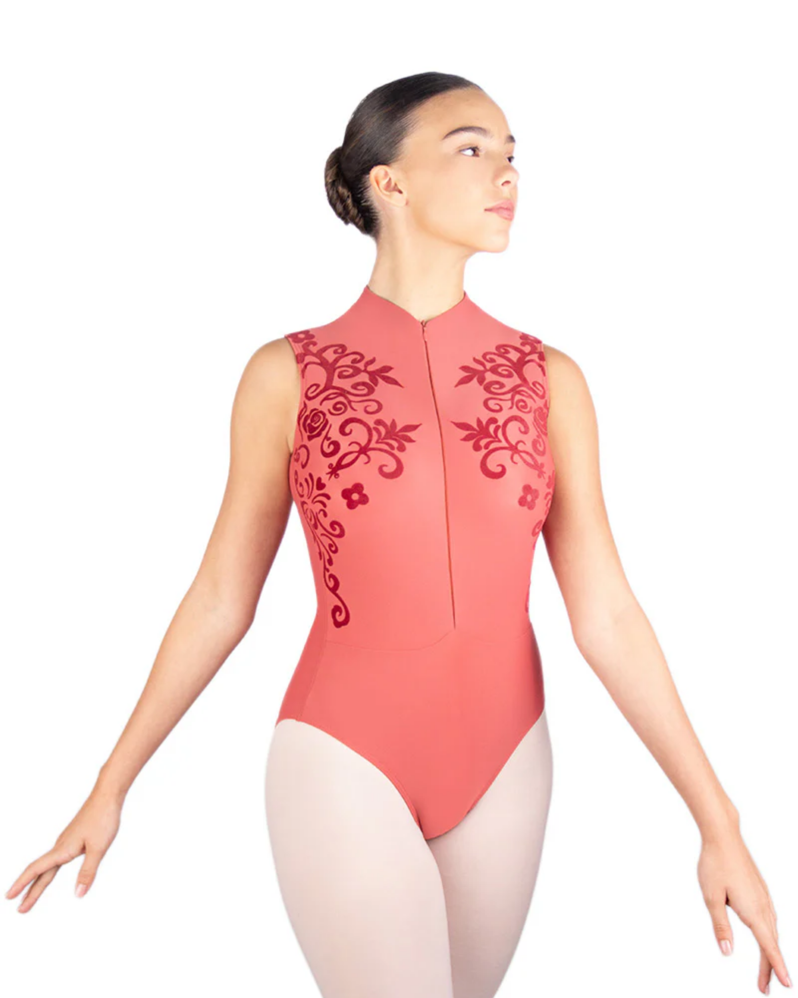 Dancer wearing a coral leotard with floral embroidery on a white background