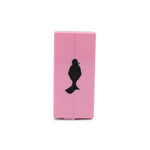 Pink product with black silhouette on a white background