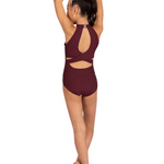 A child model shown from the back wearing a maroon one-piece leotard with a high halter-style neck and side cutouts, standing barefoot against a plain white background.