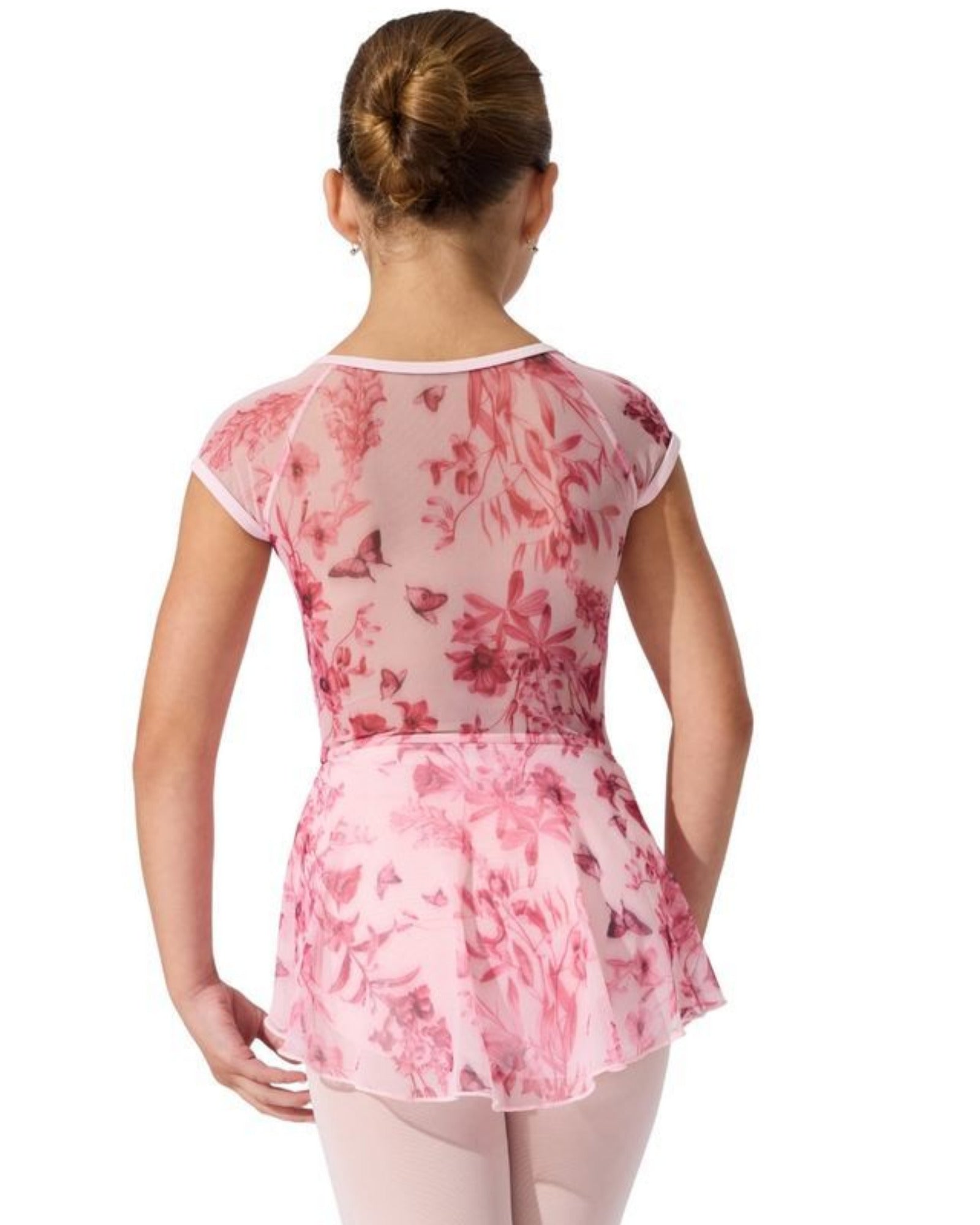 Person wearing a pink floral leotard dress on a white background