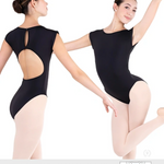 Two dancers in black leotards with built-in bras on a white background