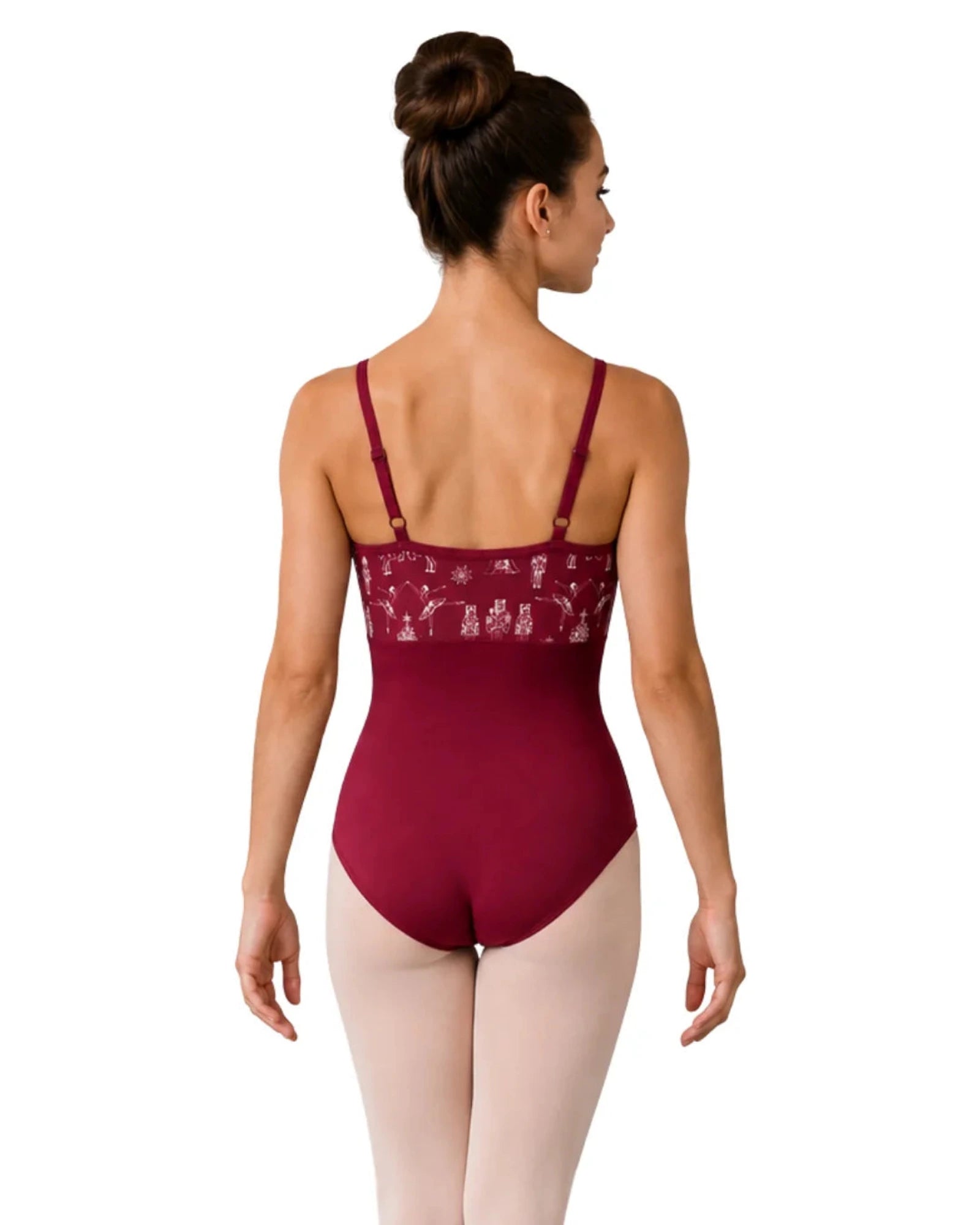 A woman modeling a burgundy ballet leotard from the back, paired with light pink tights, against a solid white background.