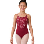 A young girl with her hair in a bun model is wearing a burgundy leotard with a white Nutcracker patterned bodice and light pink tights, standing against a solid white background.