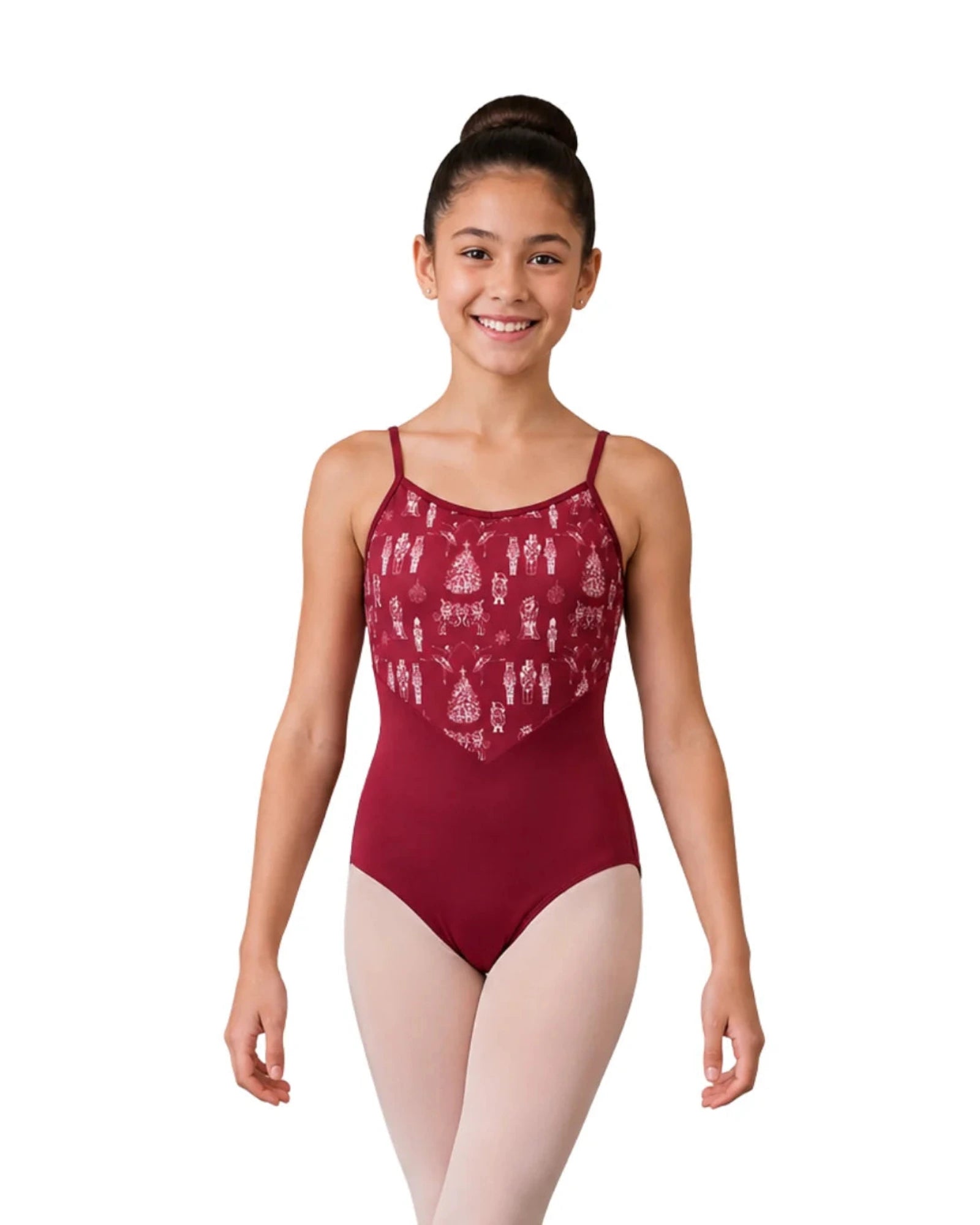 A young girl with her hair in a bun model is wearing a burgundy leotard with a white Nutcracker patterned bodice and light pink tights, standing against a solid white background.