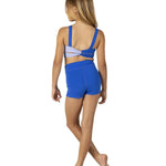 Woman wearing a blue dance bra and shorts on a white background