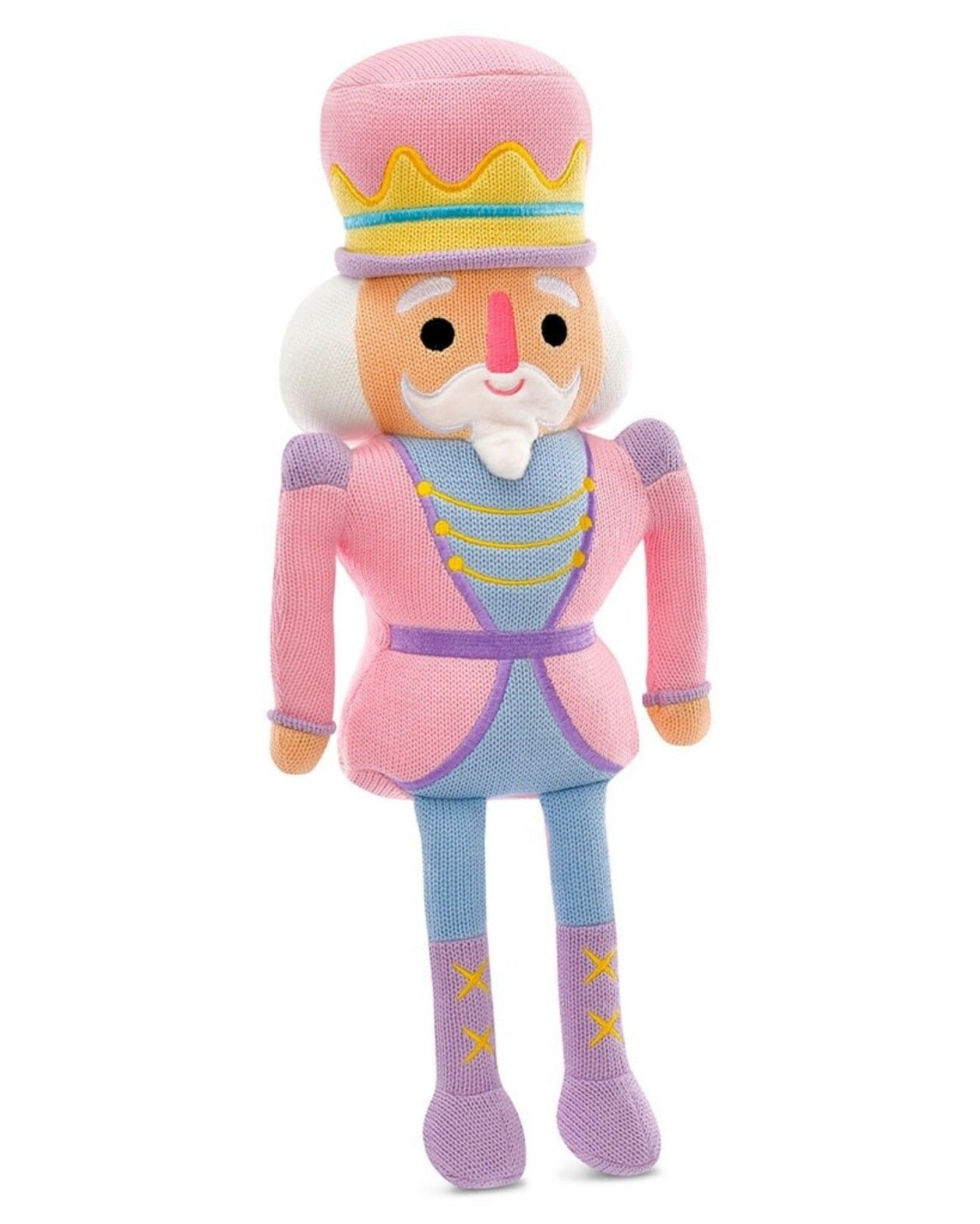 A plush nutcracker doll with a pink and lavender outfit, yellow accents, and a white beard, standing against a plain white background.