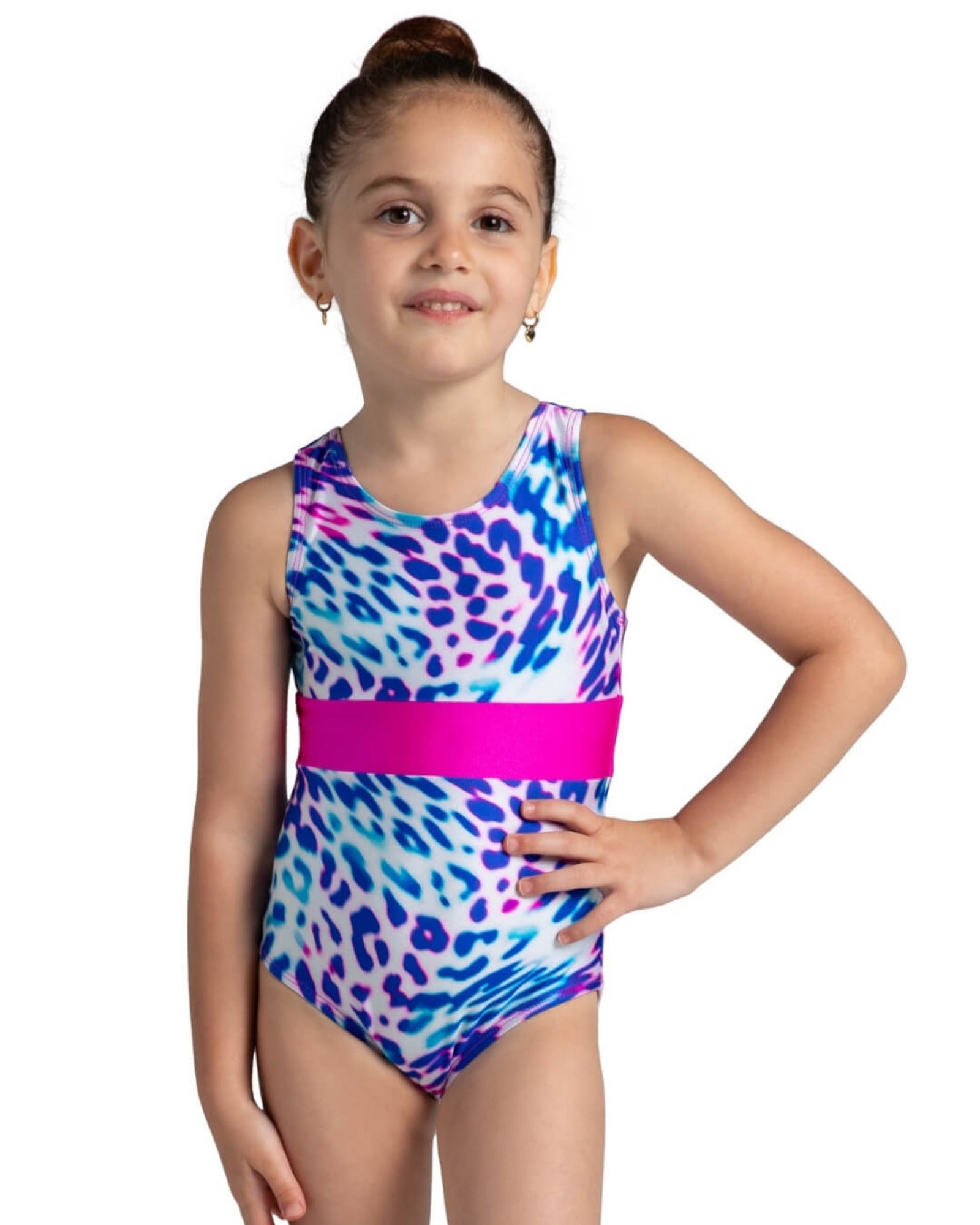 Girl wearing a colorful leotard with a pink waistband on a white background