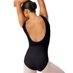 Person wearing a black leotard on a white background