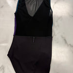 A black sleeveless leotard laid flat on a white marble surface, featuring a sheer mesh V-neck back panel, purple side panels, and teal trim.