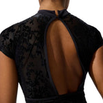 Black floral leotard with open back on a white background