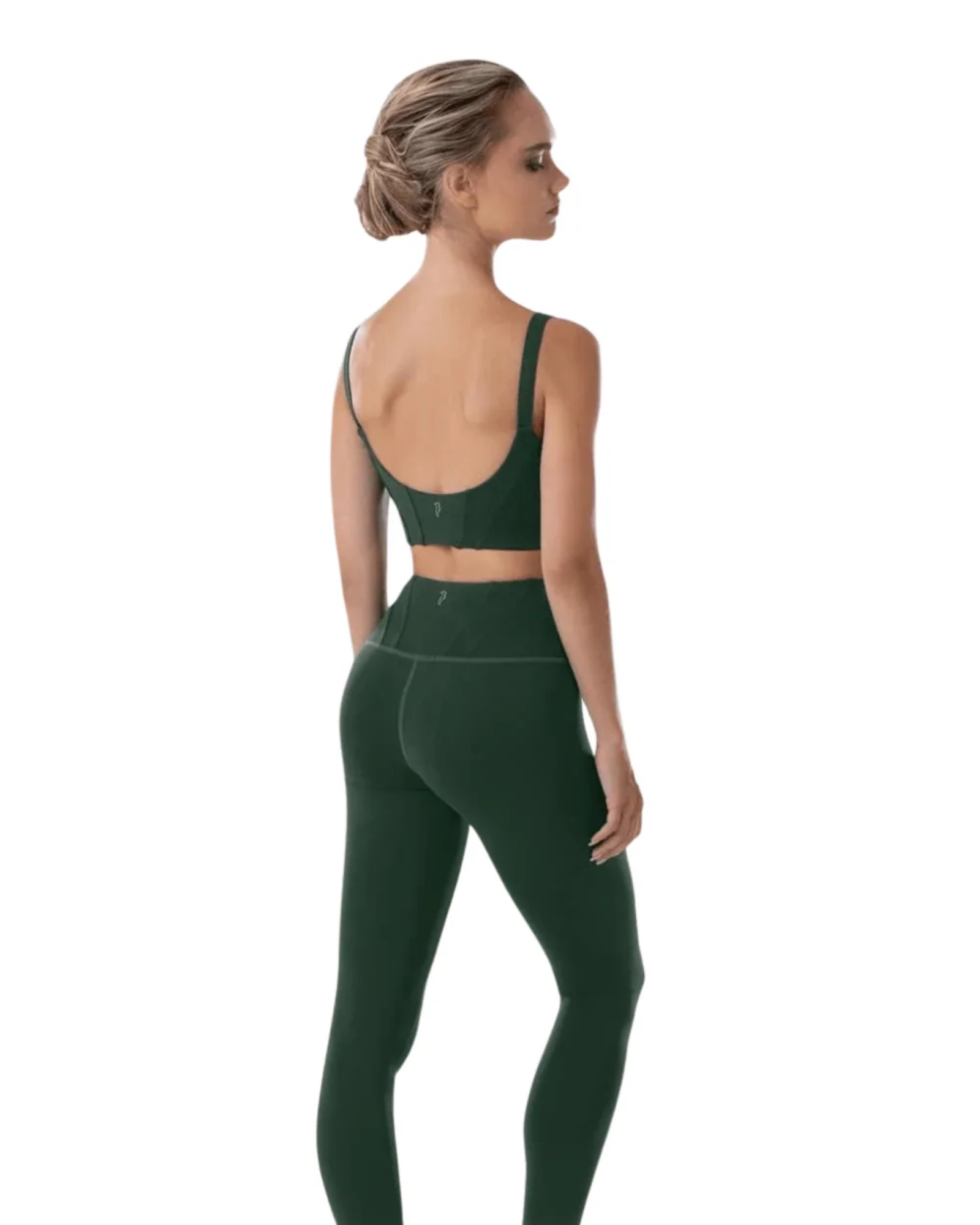 A woman shown from the back wearing a dark green sports bra and matching high-waisted leggings against a plain white background.